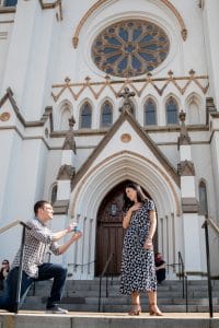 surprise proposal in front of the st johns cathedral savannah ga 