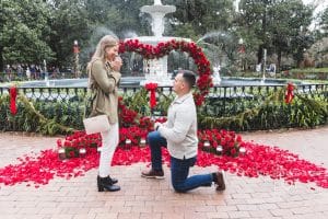 surprise proposal in savannah ga photographer with roses and marry me sign unique and fun proposal